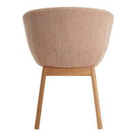 Pink textured fabric chair with wooden legs, showcasing a modern design and soft hues for a cozy ambiance.
