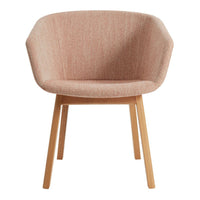 Pink textured upholstery armchair with natural wood legs, featuring a modern geometric shape.