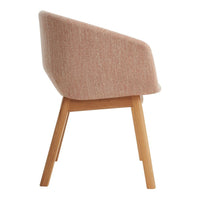 Soft pink upholstered chair with a textured pattern and wooden legs, offering a modern, minimalist aesthetic.