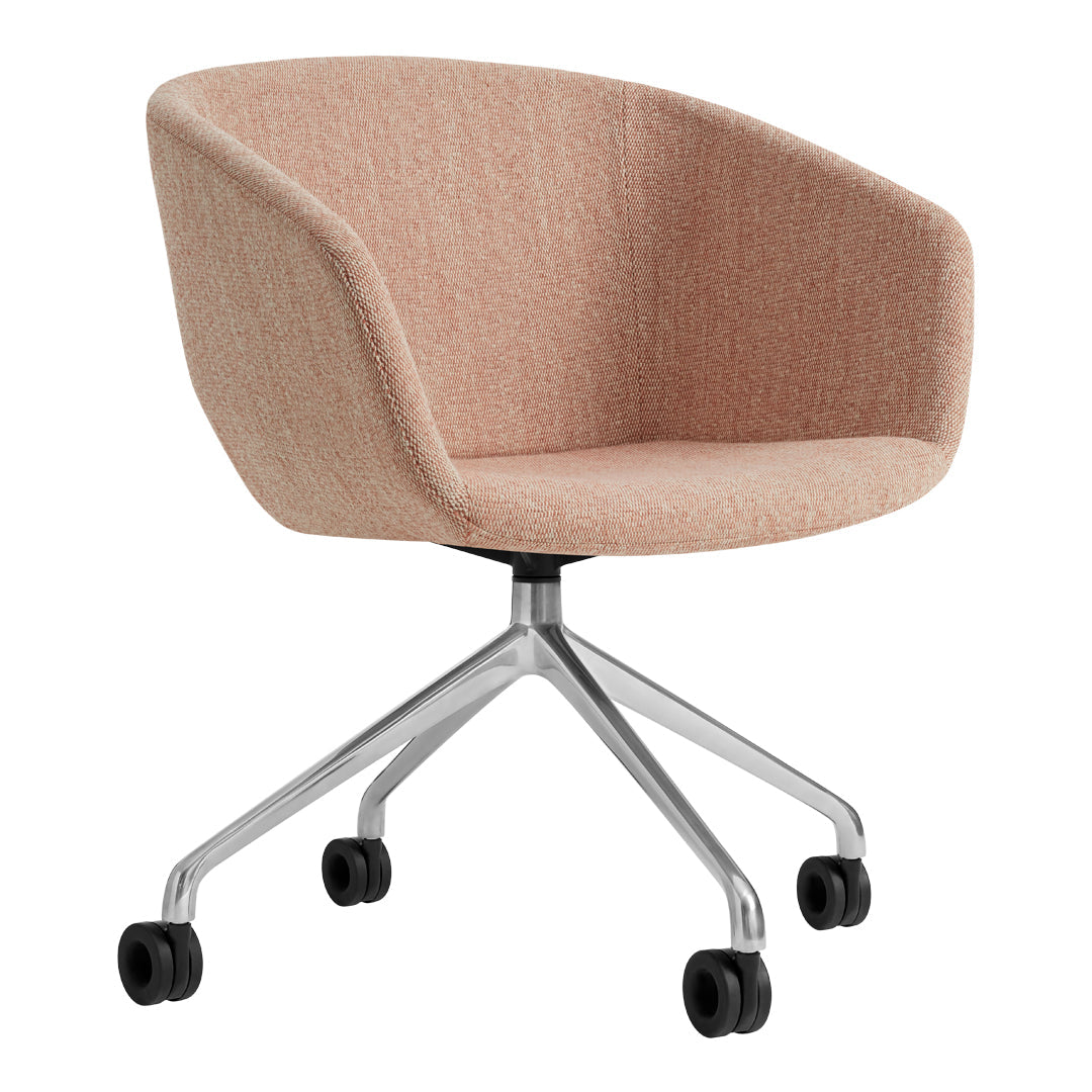 Blush pink upholstered chair with a smooth texture and a sleek silver base on rolling wheels. Perfect for modern decor.