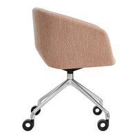 Peach fabric office chair with sleek chrome wheels and minimalist design, showcasing soft, textured upholstery.