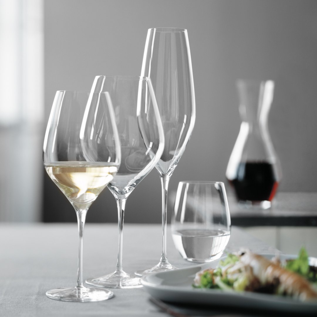 Elegant assortment of crystal glassware in clear, smooth finishes, showcasing refined shapes and modern aesthetics.