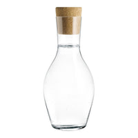 Clear glass carafe with a natural cork stopper, featuring a sleek, curvy shape. Perfect for elegant serving.