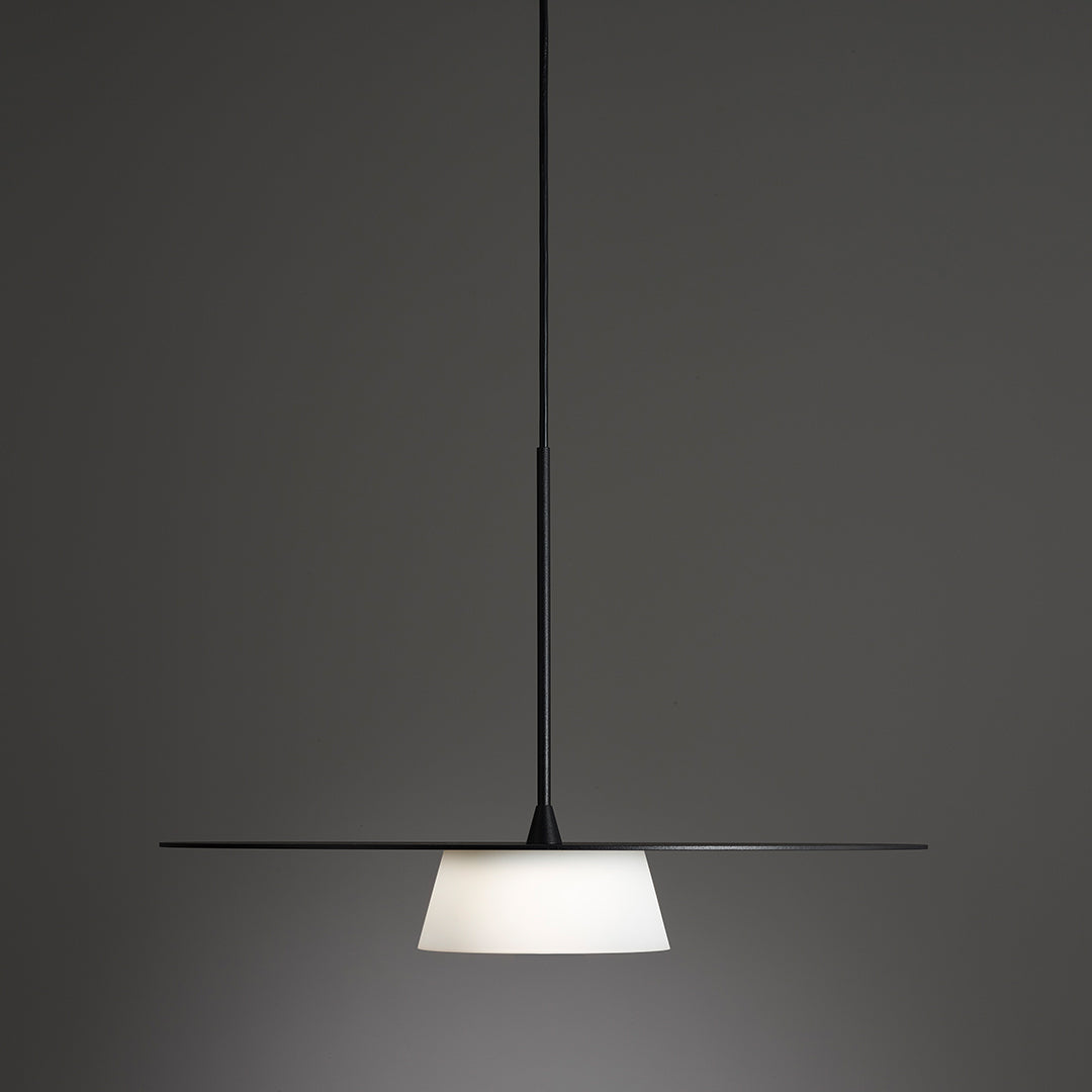 Modern pendant light in sleek black with a crisp white shade, perfect for contemporary decor.