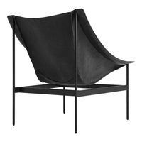 Black leather chair with a smooth, curved design and minimalist black metal frame. Sleek and modern aesthetic.