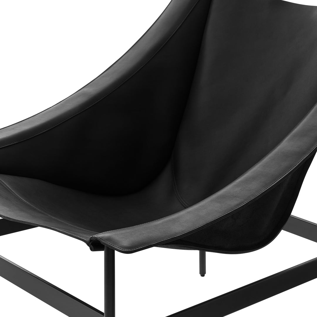 Black leather chair with a smooth, curved design and a minimalist black metal frame.