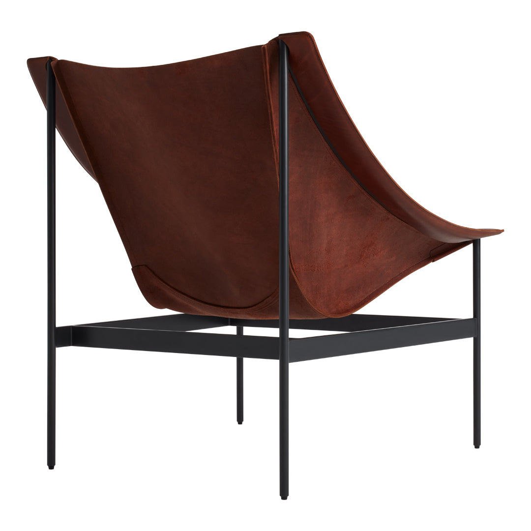 Brown leather lounge chair with sleek black metal frame, featuring smooth, minimalist curves.