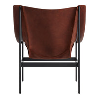 Brown leather chair with smooth textures and minimalist black metal frame. Stylish and modern home decor piece.