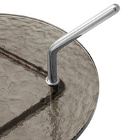 "Textured dark gray glass tabletop with a sleek silver handle, creating a modern and elegant design."