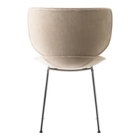 Beige upholstered chair with a smooth, curved shape and sleek metallic legs. Minimalist design with neutral tones.
