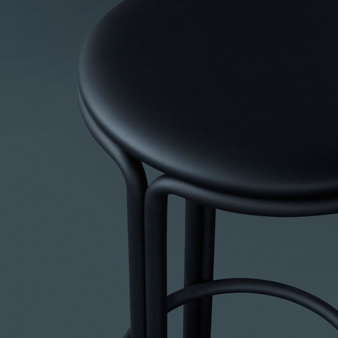 Black metal bar stool with a smooth, round seat and minimalist design, featuring sleek curves and a matte finish.