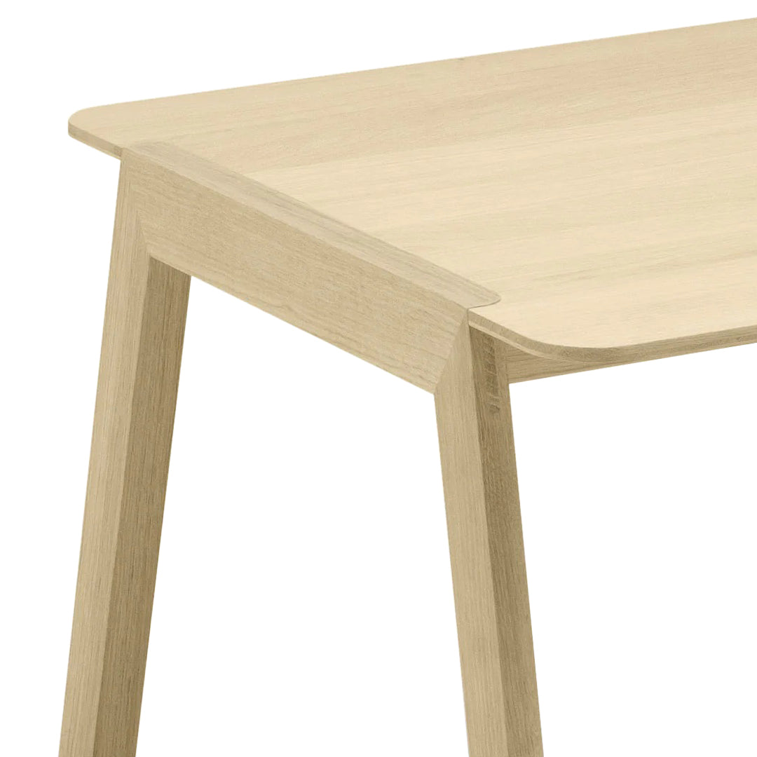 Light blonde wood tabletop with smooth edges and natural finish, complemented by minimalist design and clean lines.