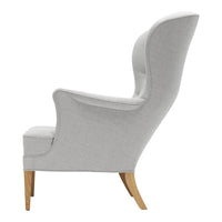 Light grey upholstered chair with a smooth surface and natural wood legs, showcasing a minimalist design.