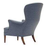 Light blue upholstery with a textured pattern and sleek wooden legs. Elegant design for modern interiors.