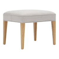 Light gray upholstered ottoman with natural wood legs, featuring a minimalist design and smooth, rounded edges.