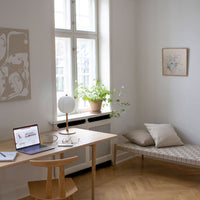 "Modern workspace with neutral tones, soft textures, and subtle geometric patterns in natural light."