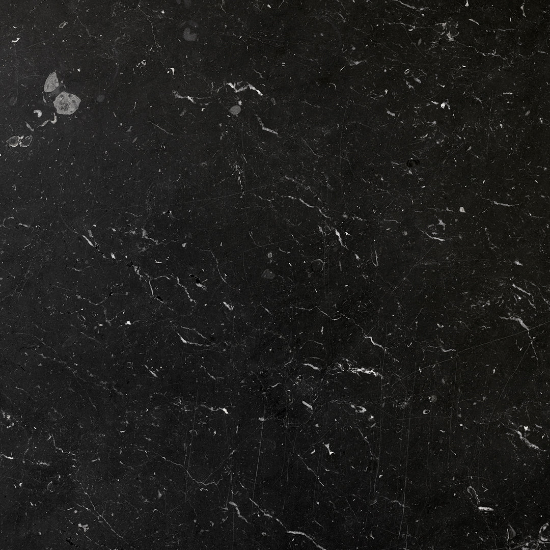Black marble pattern with white veining, featuring a polished finish and subtle texture for a sophisticated look.