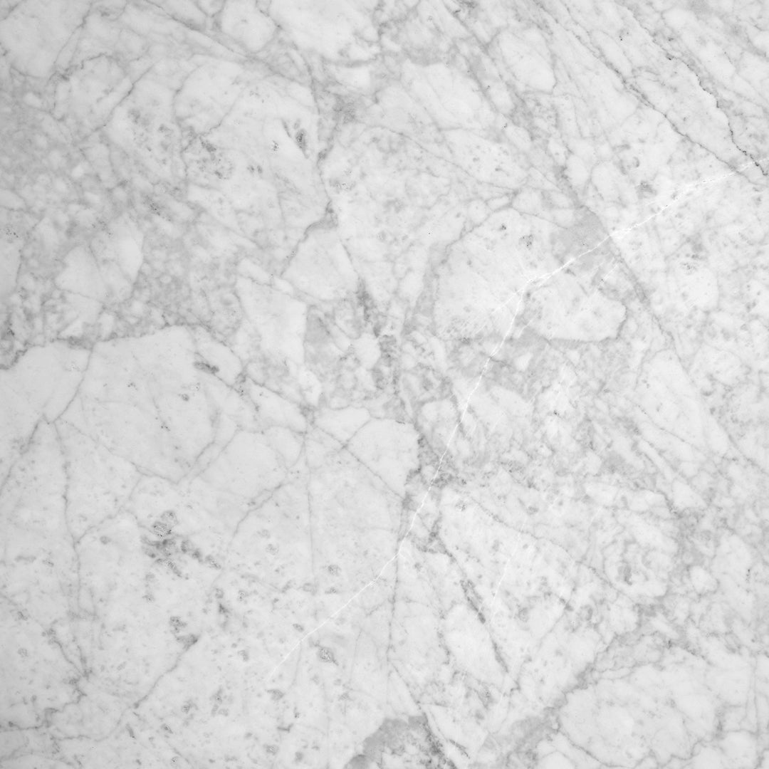Elegant white marble surface with subtle gray veining and natural textures. Perfect for stylish home decor.