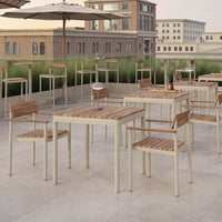 "Light beige patio furniture with wooden accents, featuring a modern, minimalist design against a cityscape backdrop."