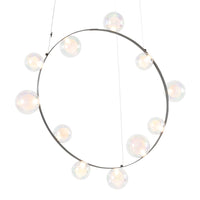 Modern circular chandelier with iridescent glass globes and sleek metal frame, featuring soft, diffused lighting.