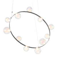 Modern black metal chandelier with clear glass orbs, featuring a sleek, minimalist design and soft, ambient lighting.