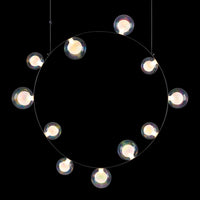 Circular pendant light featuring clear glass bulbs on a sleek black frame with a modern minimalist design.