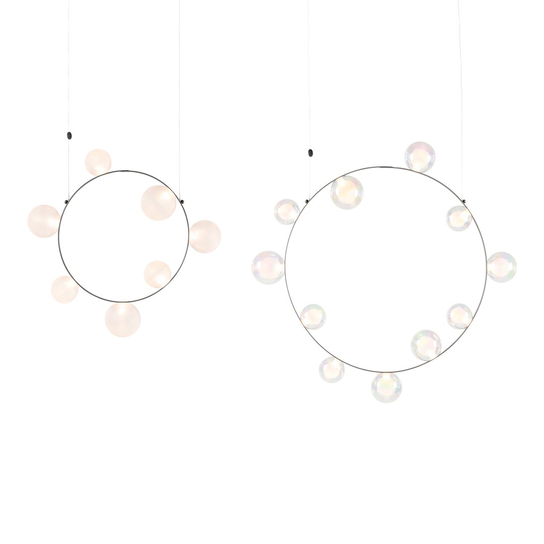 Two hanging circular decorations featuring soft pastel colors and iridescent bubble patterns on silver frames.