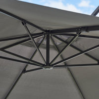 Gray outdoor umbrella canopy with a sleek, minimalist design and green accents on the support structure.