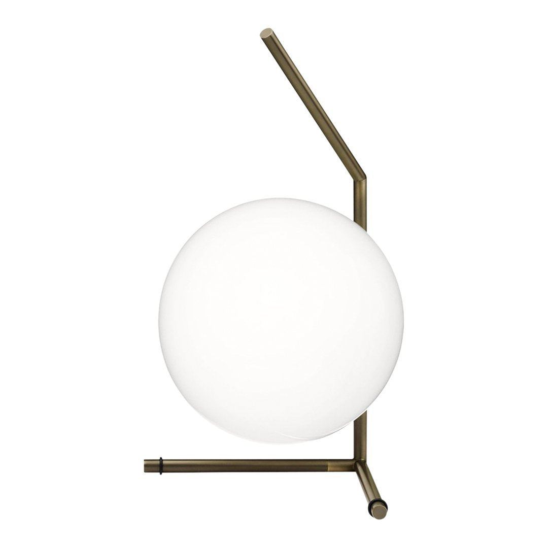 Modern lamp with a smooth white globe and an elegant brass frame; minimalistic design with clean lines.