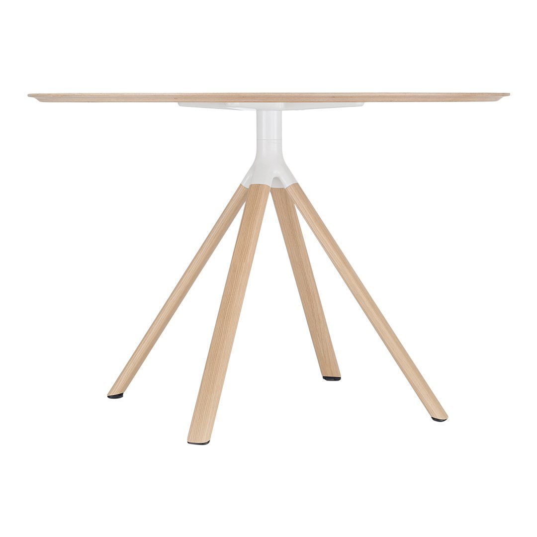 Modern round table with a light wood top and white base, featuring natural wood grain patterns and sleek design.