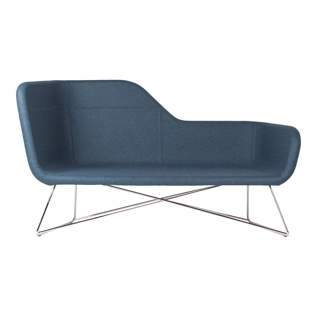 Mid-century modern sofa in deep blue fabric with smooth, minimalist design and chrome legs. Perfect for contemporary decor.