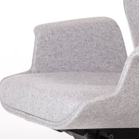 Gray upholstered chair with a smooth, textured fabric and minimalist design. Perfect for modern decor.