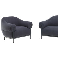 "Dark gray boucle fabric armchairs with smooth, rounded contours and black metal legs."