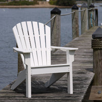 White Adirondack chair on a dock, featuring a smooth, slatted design and classic curved backrest.