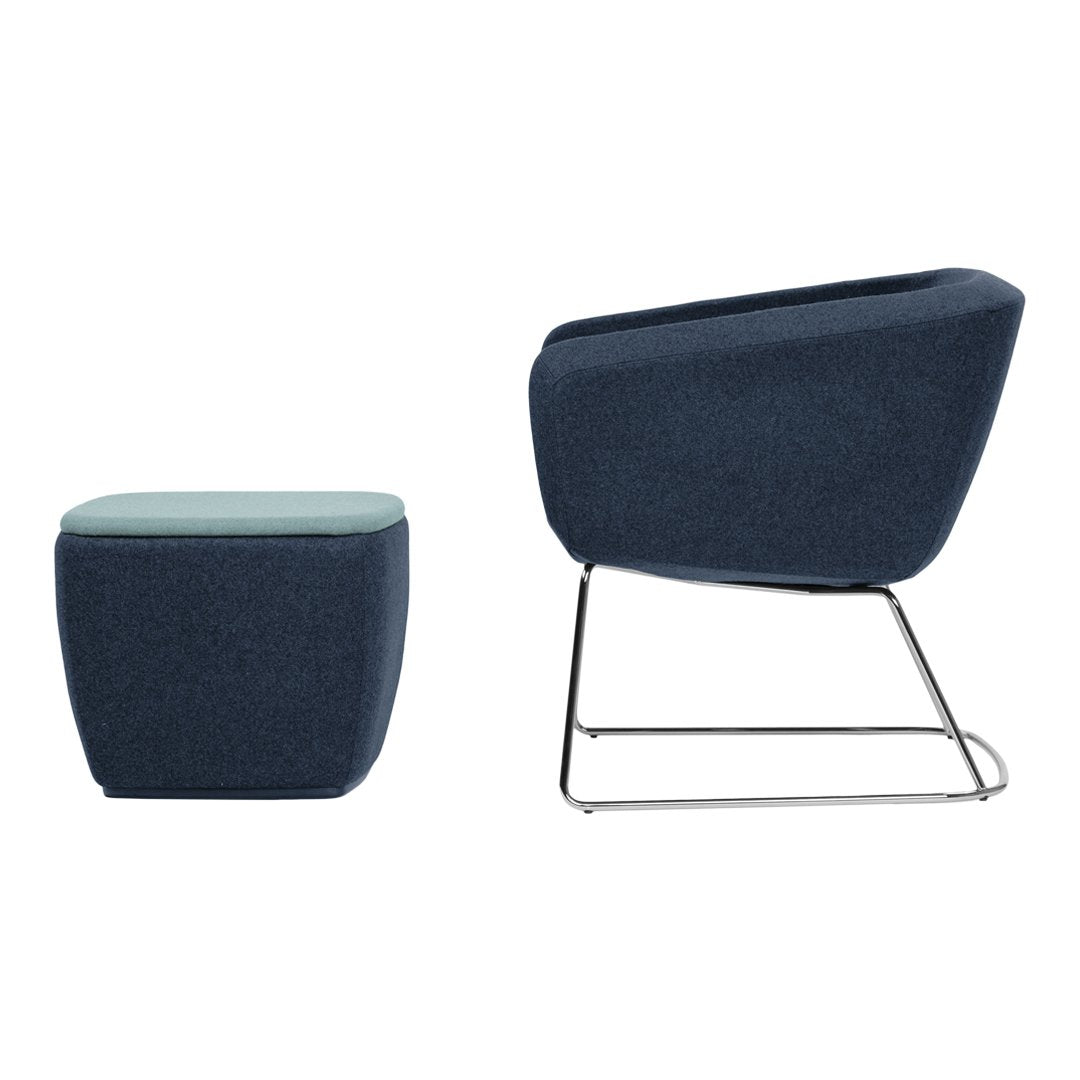Blue upholstered chair and matching stool with sleek metal bases, featuring solid color and modern geometric design.
