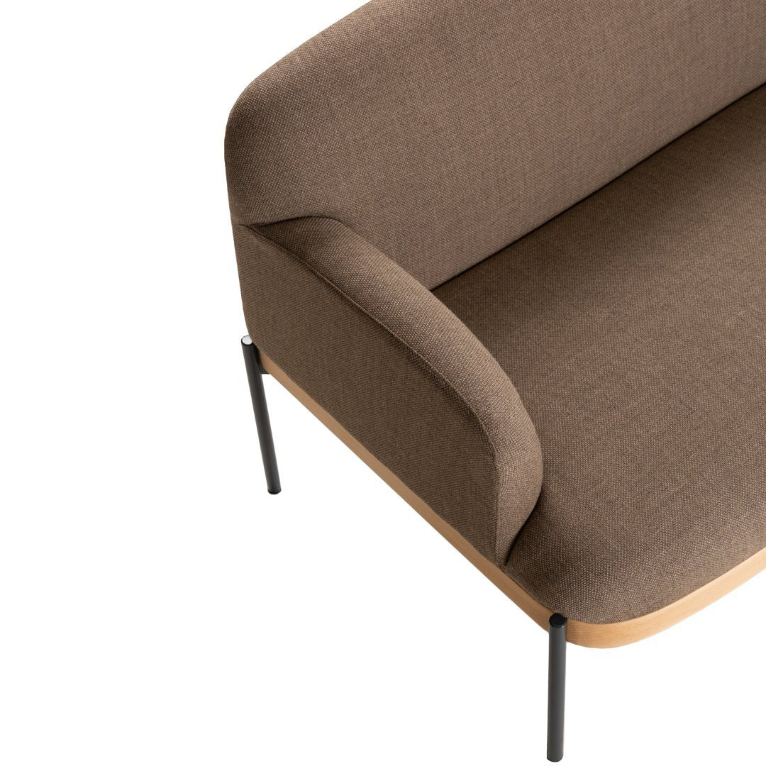 Brown upholstered sofa with a smooth texture and minimalist design, complemented by sleek black metal legs.