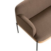 Brown upholstered sofa with a smooth texture and minimalist design, complemented by sleek black metal legs.