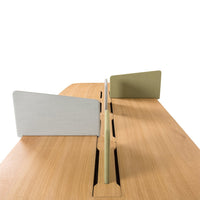 Light wood desk with a smooth finish, featuring gray and green acoustic panels and a sleek, minimalist design.