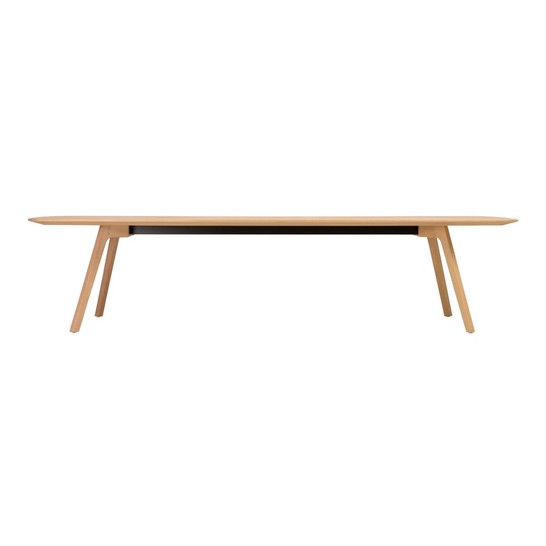 Light wood dining table with a smooth, simple design and natural finish, featuring tapered legs and a minimalist aesthetic.