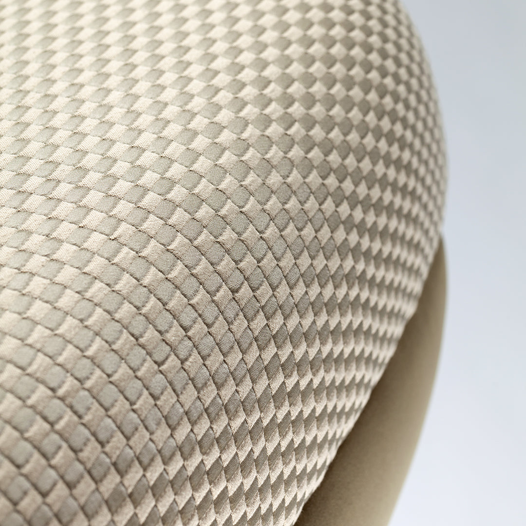 Beige textured upholstery with a diamond pattern, creating a sophisticated and modern look.