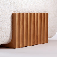 Bamboo base with light wood finish and textured cream surface, featuring vertical grooves for a modern design.