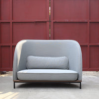 Light gray upholstered sofa with a smooth texture and a solid wood base, featuring a simple, modern design.
