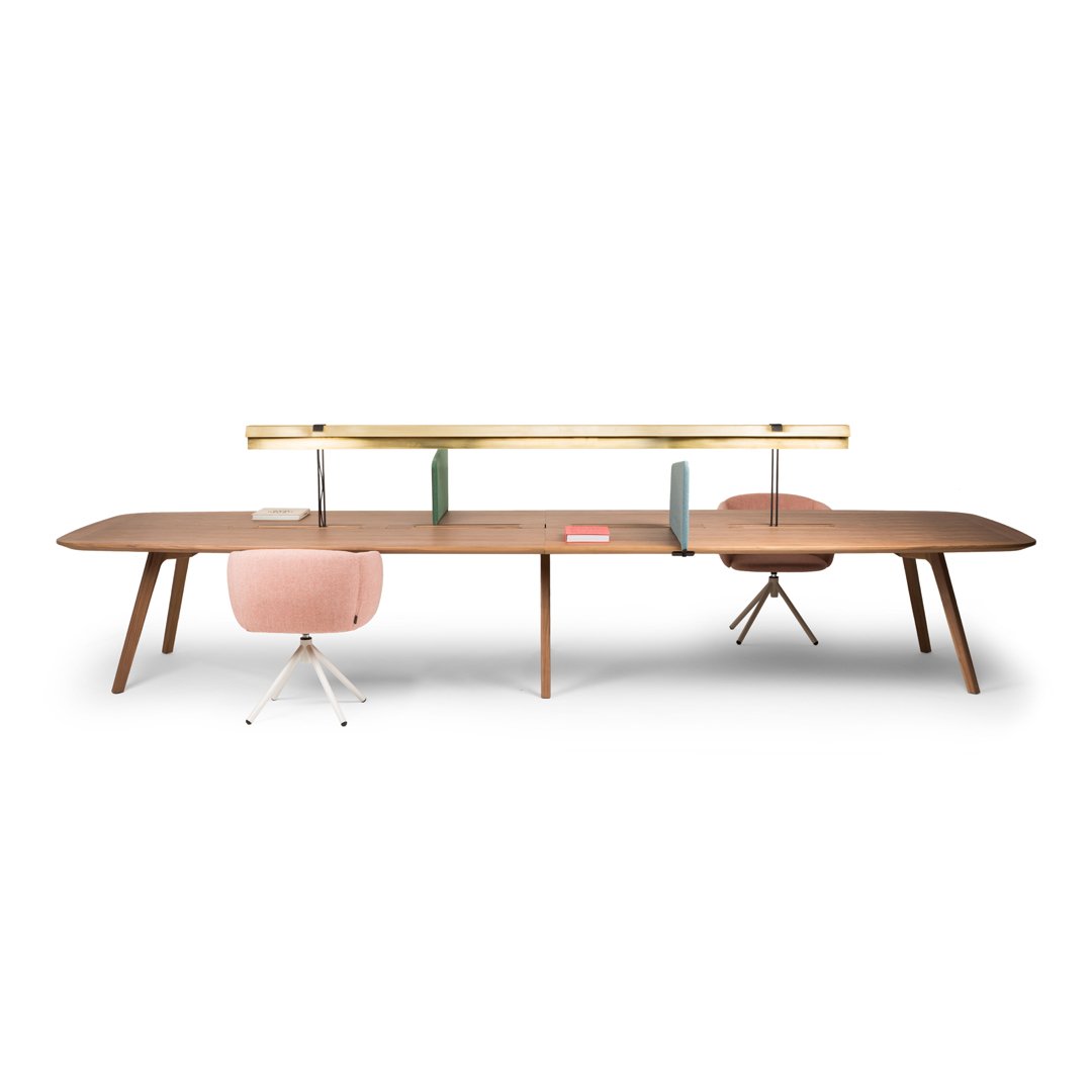 Modern wooden desk in rich brown with light pink and green accents; sleek design with minimalist patterns.