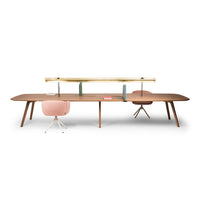 Modern wooden desk in rich brown with light pink and green accents; sleek design with minimalist patterns.