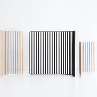 Three modern decorative panels featuring alternating black and natural wood stripes in minimalist designs.