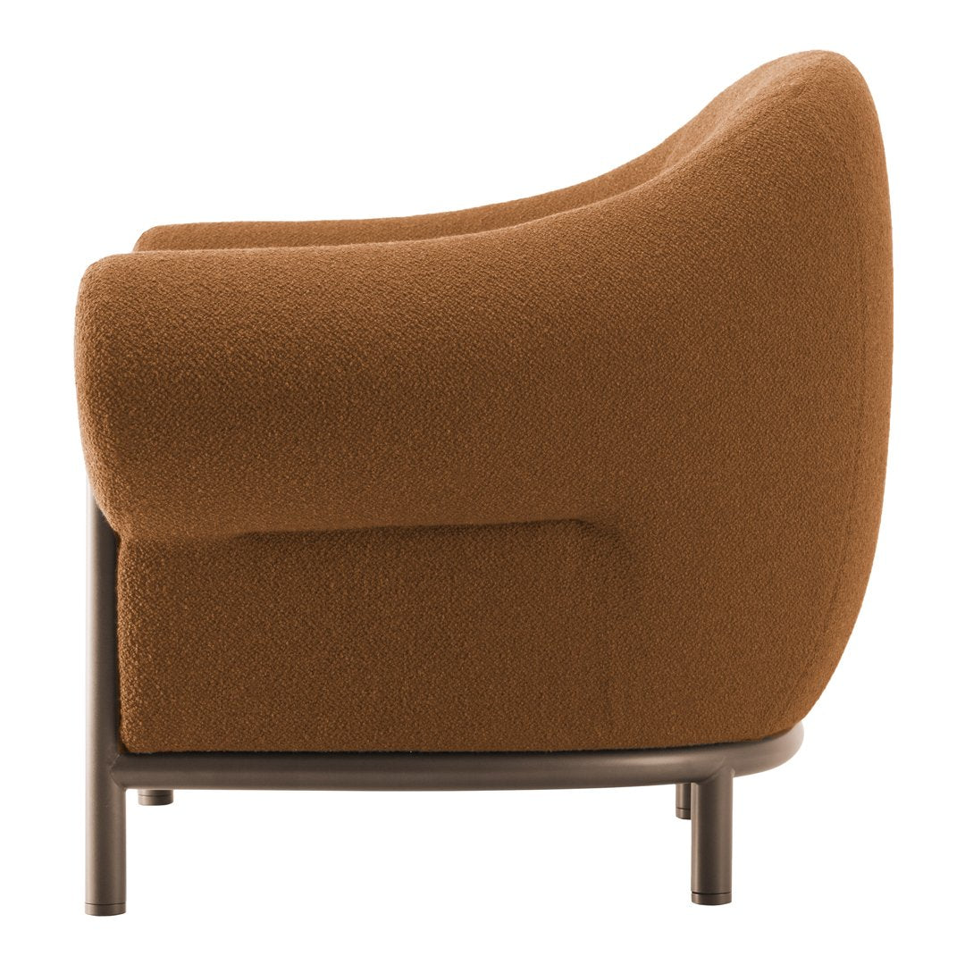 Brown textured fabric armchair with a curved silhouette and modern black metal legs.