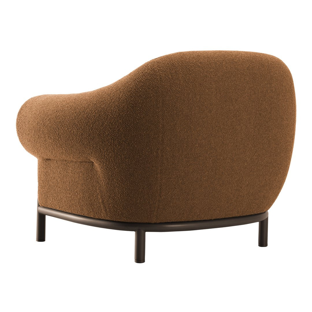Brown textured armchair with a rounded silhouette and black metal legs. Ideal for modern decor.