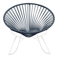 Navy blue Acapulco chair with a radial design and white metal base, perfect for modern decor.