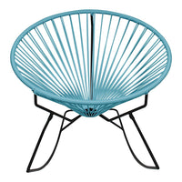 Turquoise round chair with a sleek wire design against a black metal frame, showcasing modern elegance.