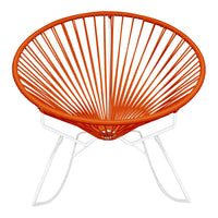 Orange hued Acapulco chair with a unique ribbed pattern and white metal legs, perfect for modern outdoor decor.